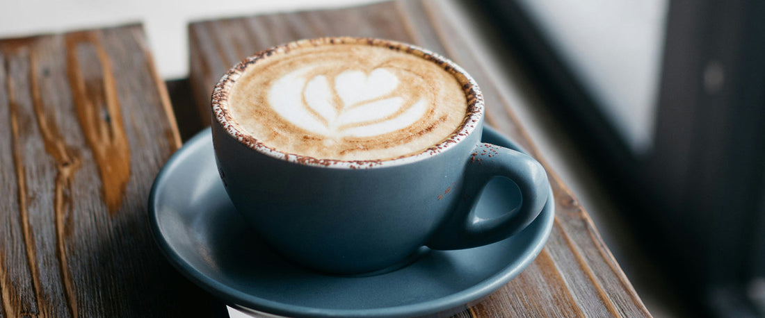 A freshly made latte in a coffee mug.