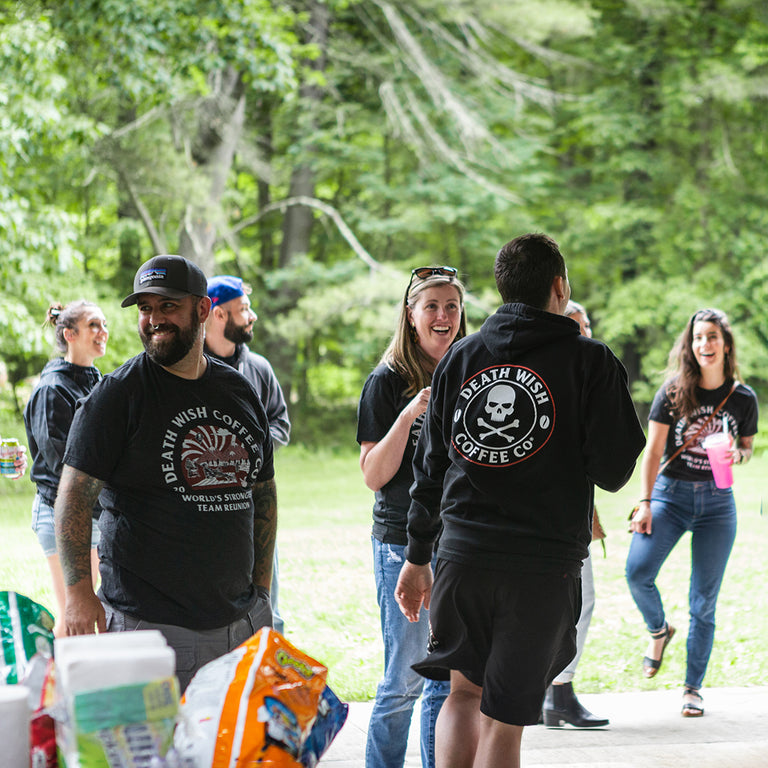 A group of Death Wish Coffee employees mingling at an off-site picnic.