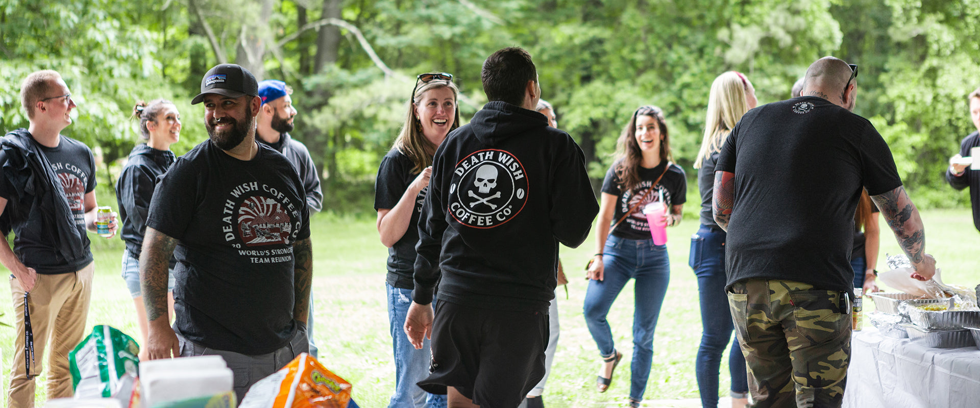 A group of Death Wish Coffee employees mingling at an off-site picnic.