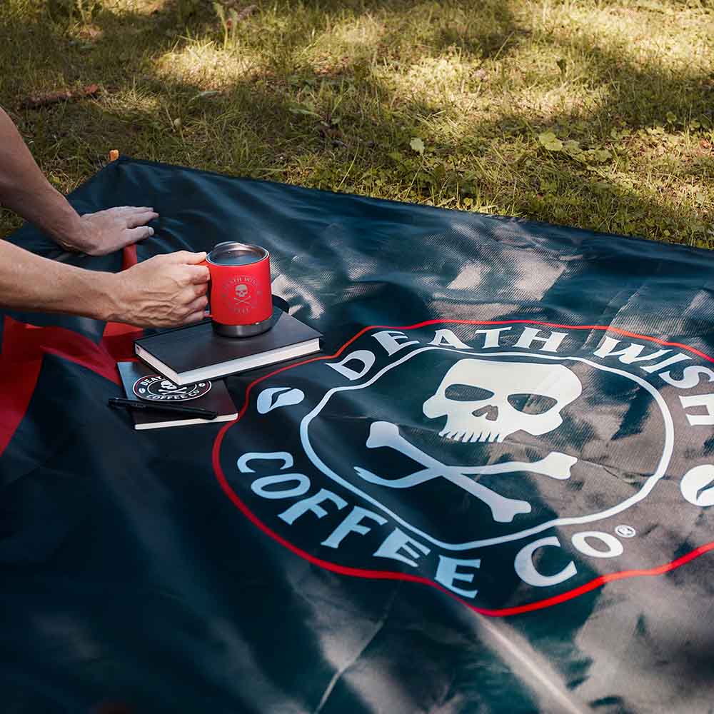 Coffee and books on the Death Wish Coffee Bold Logo Blanket