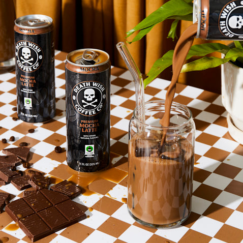 Pouring the Death Wish Coffee Premium Mocha Latte into a glass.