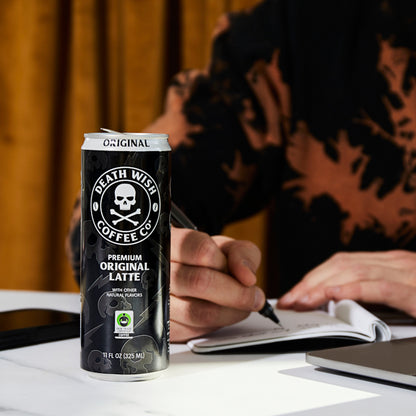 Taking notes fueled by the Death Wish Coffee Premium Original Latte.