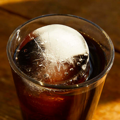 A close up of ice cubes from the Death Wish Coffee Brain Freeze Ice Molds sitting in iced coffee.