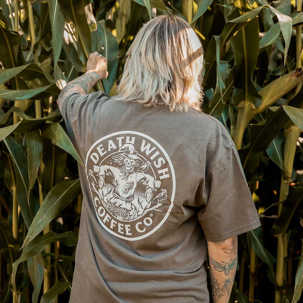 Walking through corn in the Death Wish Coffee Patchwork Pocket Tee.