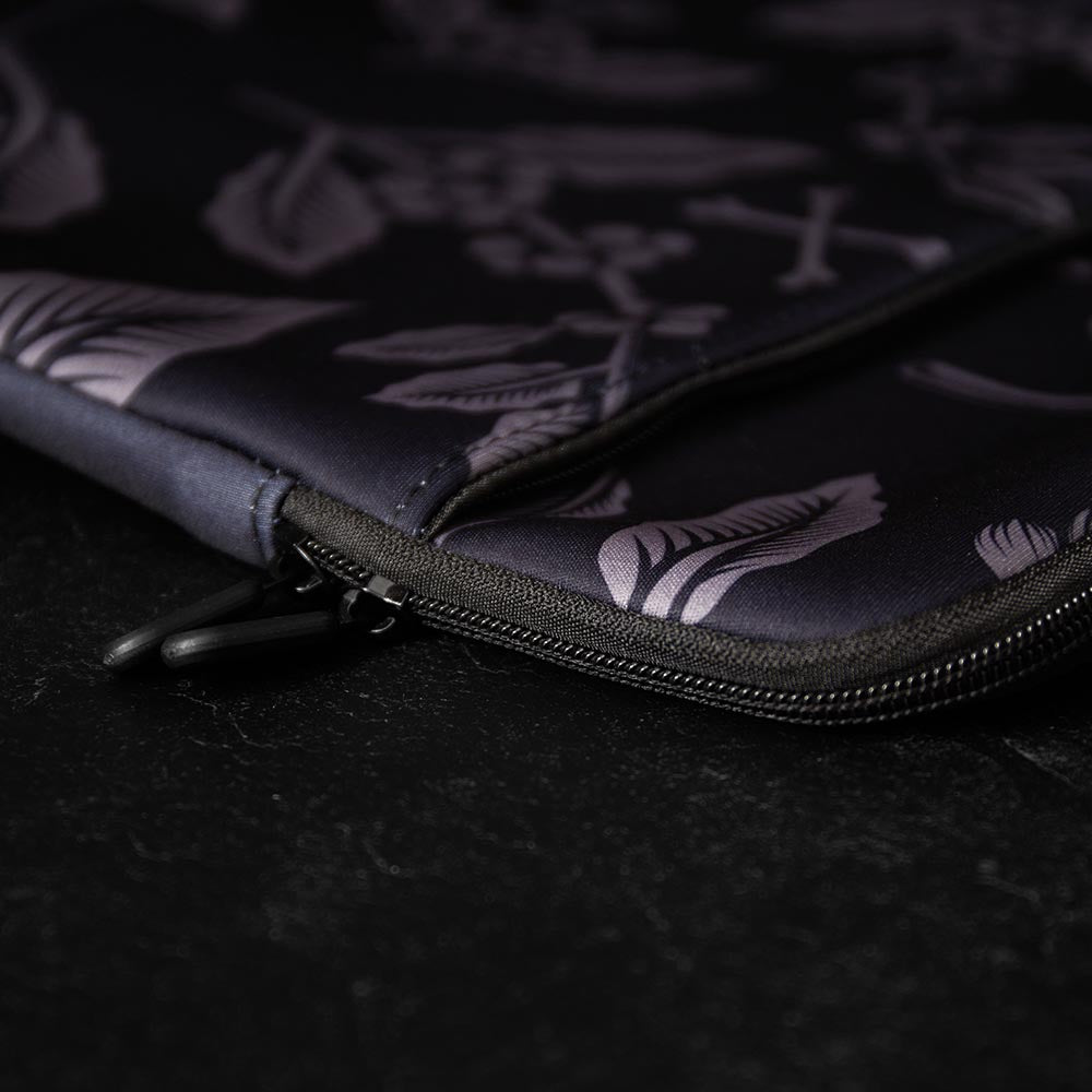 The zipper detail of the Death Wish Coffee Let It Bloom Laptop Sleeve.