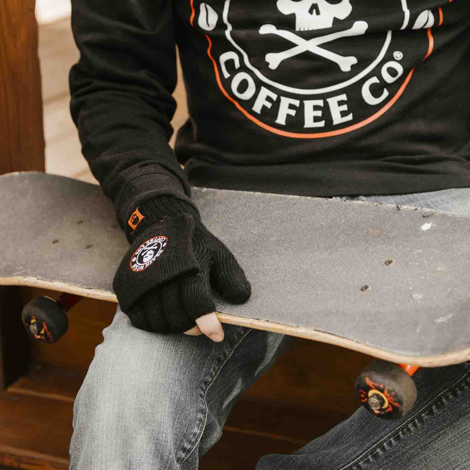 Skateboarding on a cold day in the Death Wish Coffee To The Bone Breakaway Gloves.