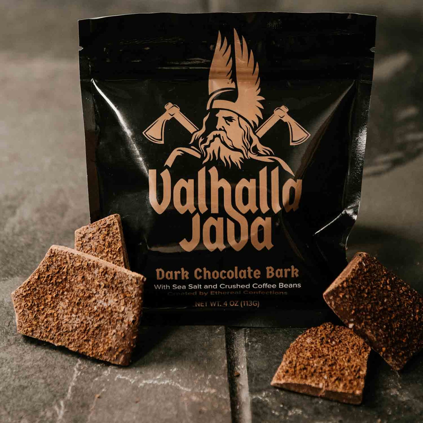 A bag of Death Wish Coffee Valhalla Java Dark Chocolate Bark with pieces outside of the bag.